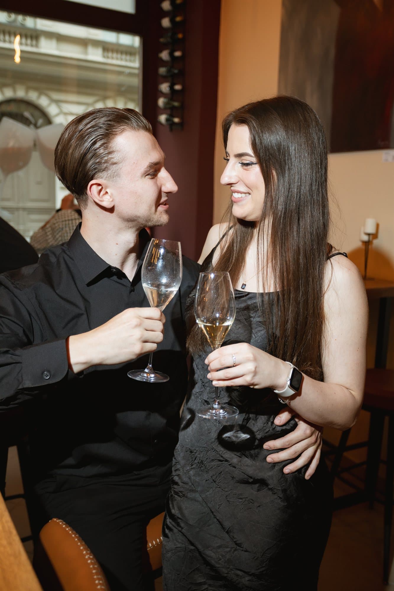 Guests raising a toast with glasses of wine