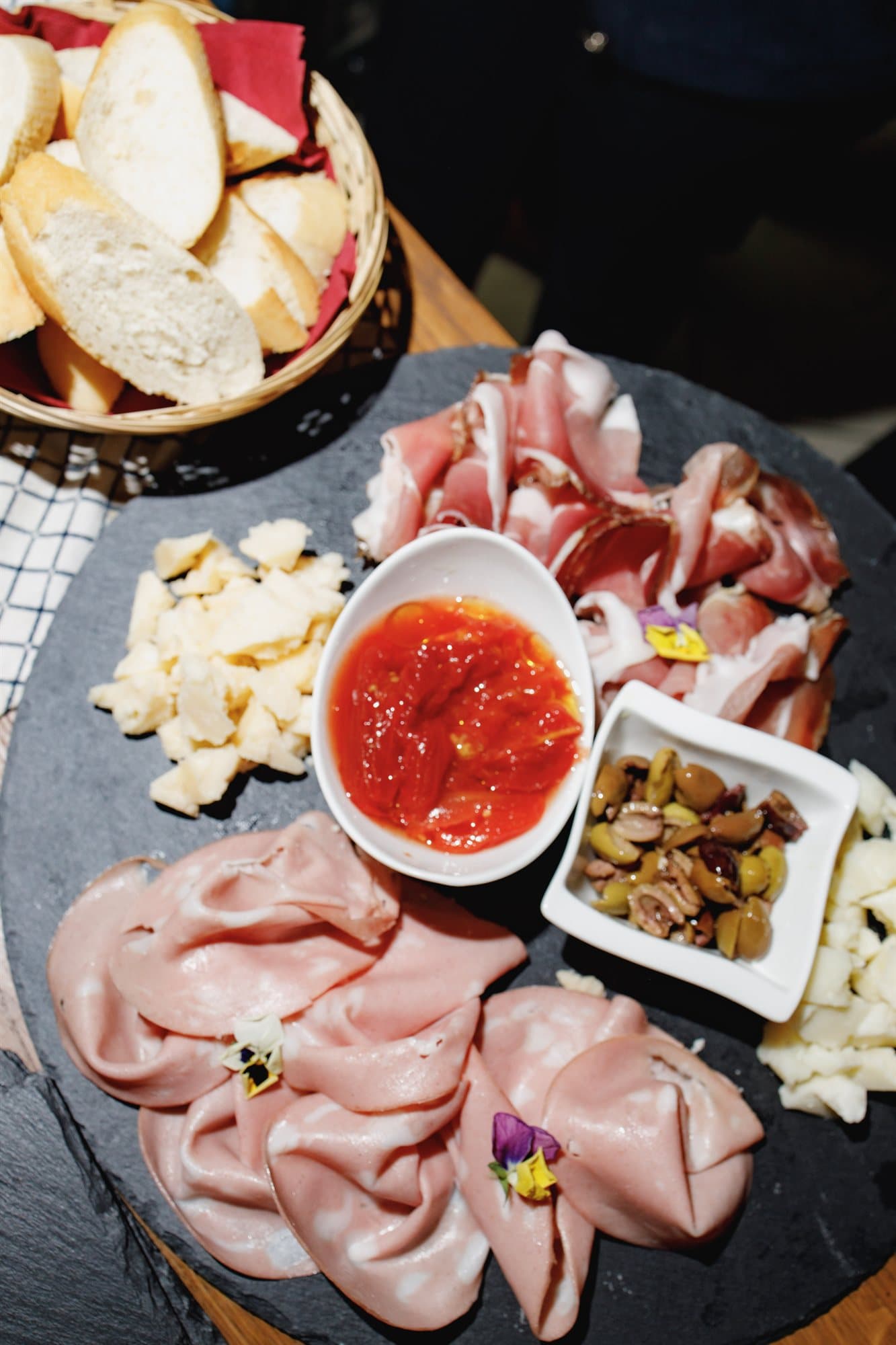 A taglieri board photographed from above with dipping sauces