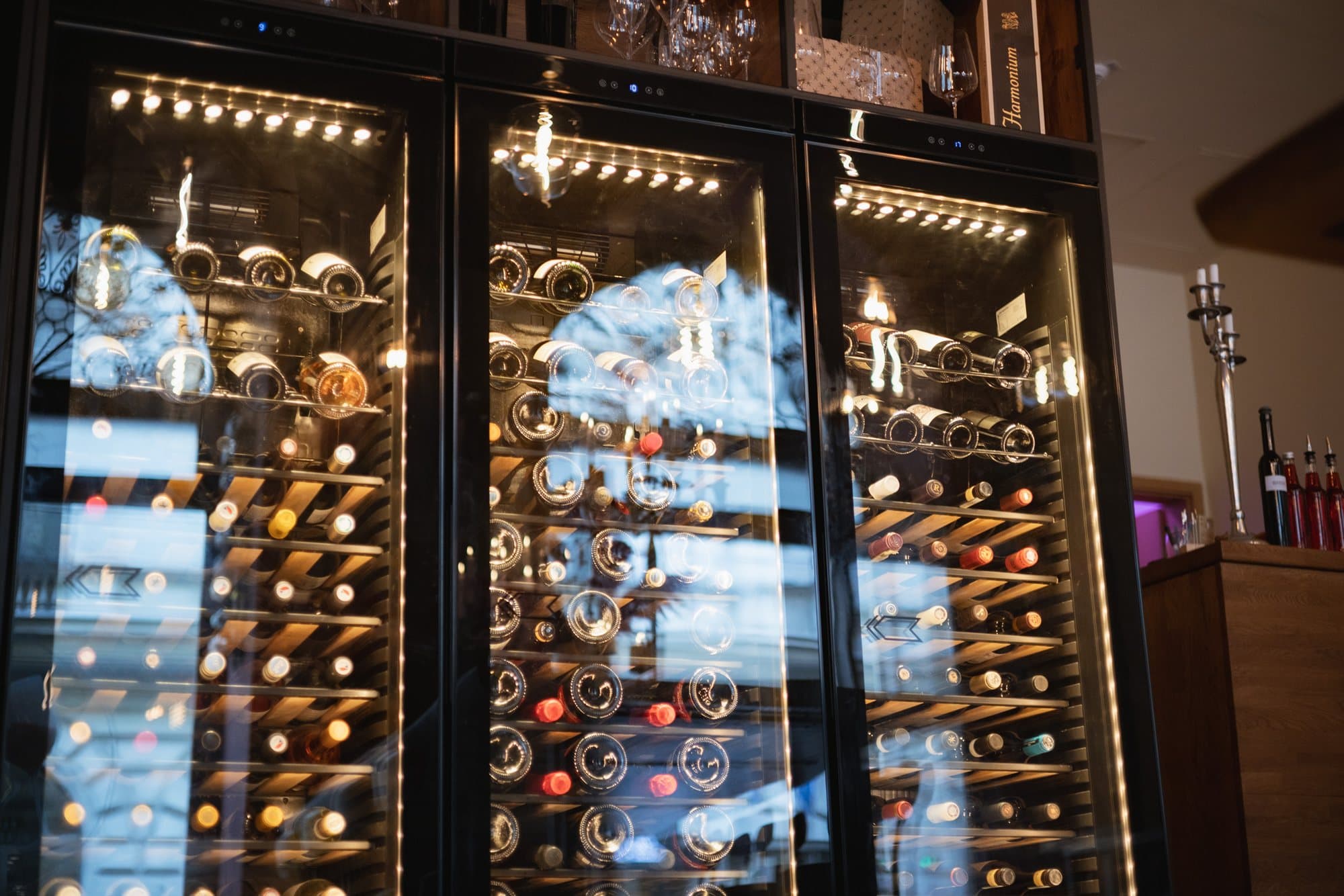 Temperature-controlled cabinets lined with bottles from the cellar